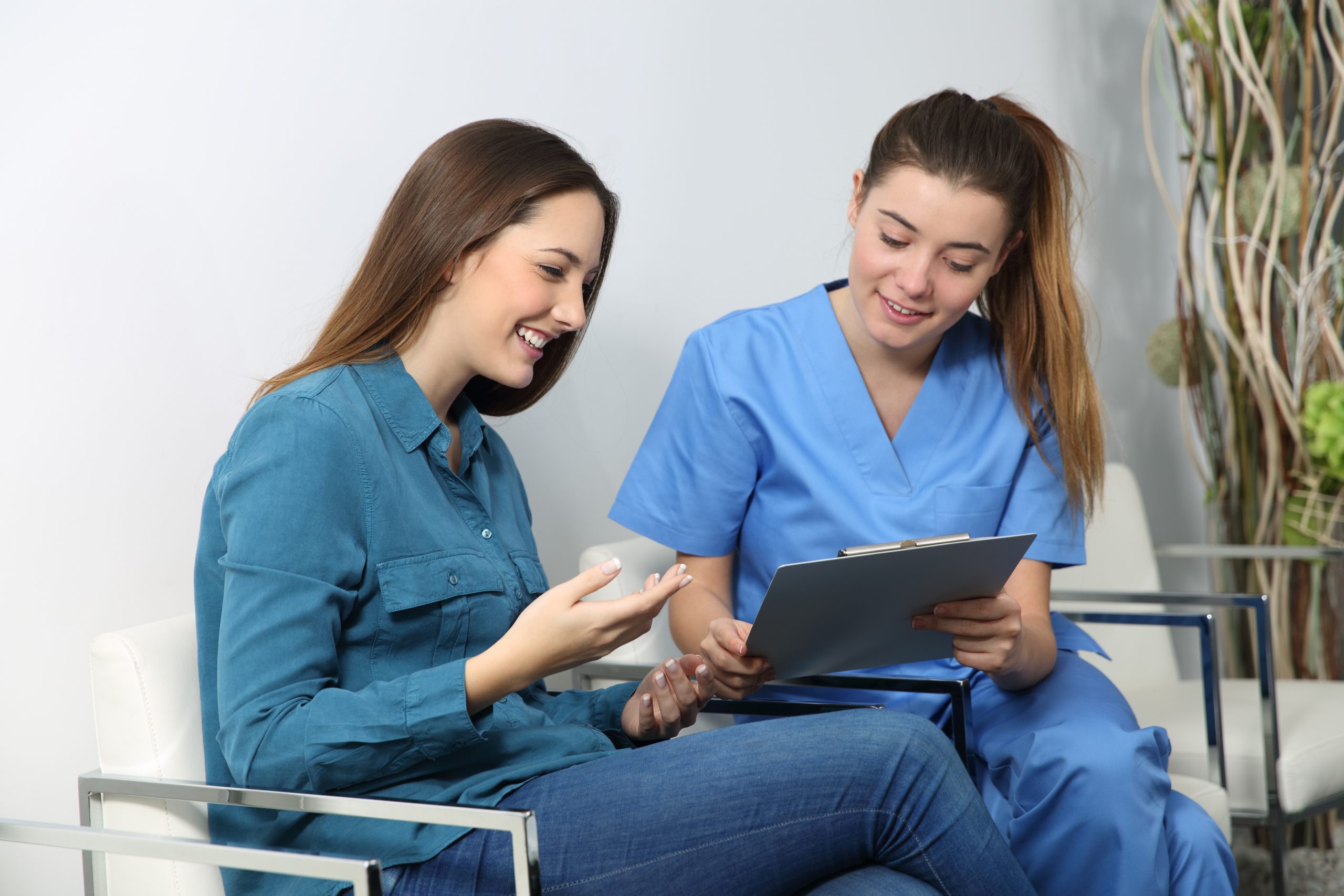 Nurse explaining medical procedure to a patient