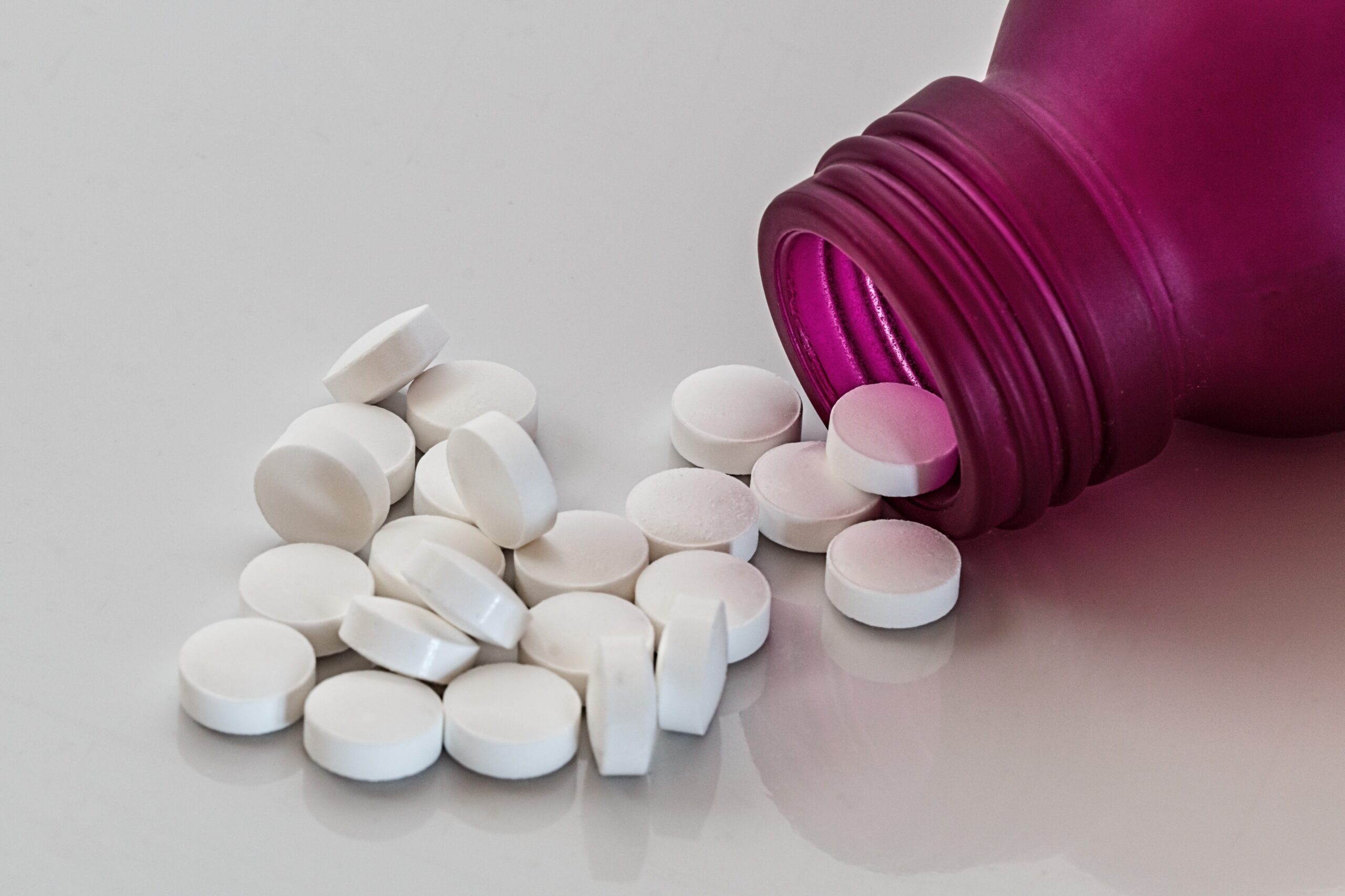 Benzodiazepine bottle, scattered pills